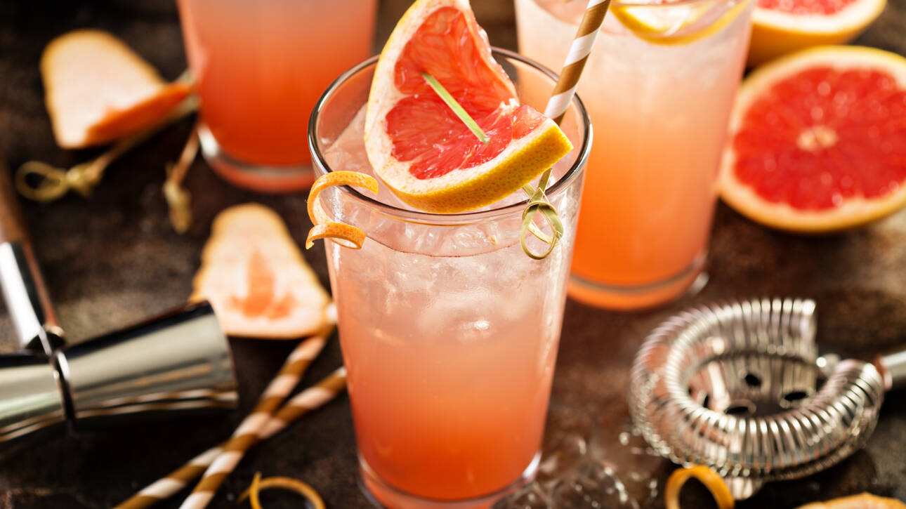 Grapefruit cocktail in tall glasses with ice and sparkling water